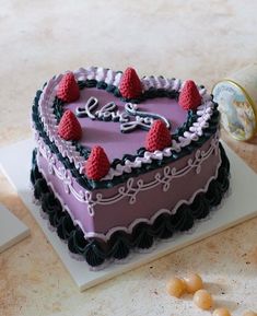 a heart shaped cake sitting on top of a table