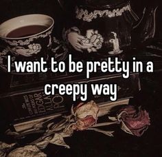 the words i want to be pretty in a creepy way on top of some books