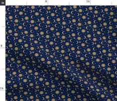 a blue background with gold stars and crescents on it, as well as a ruler