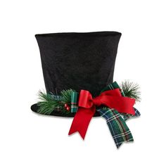 a black top hat with red ribbon and green plaid bow on the side, decorated with pine branches