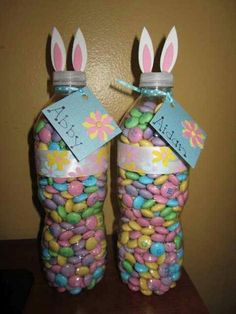 two bottles with candy and bunny ears on them