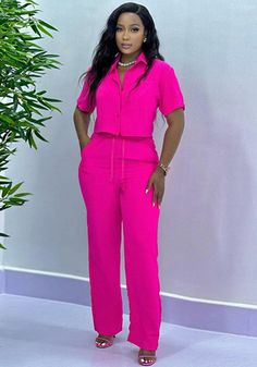 Chic Short Sleeve Solid Color Sets, Pink Two-piece Set For Spring, Solid Two-piece Pant Set For Work, Spring Two-piece Set With Short Sleeves, Casual Fitted Pink Pantsuit, Solid Matching Pant Set For Spring, Spring Solid Color Matching Pant Set, Spring Solid Pant Set With Pockets, Solid Pant Set With Pockets For Spring