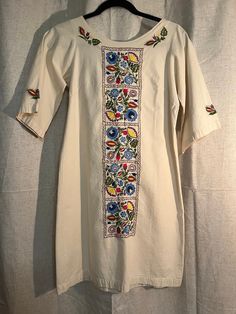 Vintage Boho Embroidered Tunic Dress. Cotton dress. Boho vibes. Vintage. Open to offers! Approx. Measurements Laying Flat: 34" length 18" pit to pit.  Will fit an XS/S For reference, mannequin measurements are as follows: Height: 69" (5'9") Chest: 32" Waist: 24" Hip: 34" All measurements of items listed are approximate, and are taken as accurately as I can to the best of my ability. Please note that with vintage items, there may be signs of wear and small imperfections. When possible, we will show imperfections and the price will reflect these. If you have any questions, or would like to see more pictures, please don't hesitate to reach out. Embroidered Tunic Dress, Embroidered Tunic, Kansas City Mo, Dress Cotton, Dress Boho, Boho Vibe, Dress Clothes For Women, Vintage Boho, Cotton Dress