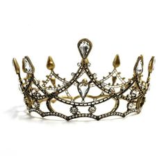 This crown positively architectural in its intricate structure. A Gothic presence to instill love and fear all at once ... but tiny. Rule the underworld in this tiara! Hell, raise tiny skyscrapers in the underworld! You are now one with the crown. Crown comes with a velvety soft storage bag Metal alloy. Mini crown measures 4.2" diameter  please note mini size! This can be propped on the head with hairpins or is about the size to go over a hair bun. Also makes a cute decoration. By Paper & Quartz Love And Fear, Gothic Crown, Mini Crown, Crown Tiara, The Underworld, Queen Crown, Sparkly Things, Hair Bun, Tiaras And Crowns