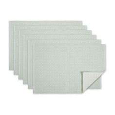 six white placemats on a white background