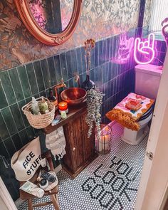 a bathroom with a sink, toilet and mirror