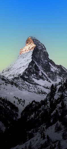 the top of a mountain with snow on it