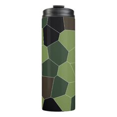 a green and black geometric pattern on a stainless steel tumbler cup, with an insulated lid