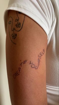 a woman's arm with writing on it