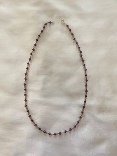 super cute handmade necklace. can be adjusted by using the loops in between each bead. it's a really pretty dark magenta-ish color Dark Beaded Necklace, Handmade Burgundy Beaded Necklaces For Gifts, Handmade Burgundy Beaded Necklaces As Gift, Burgundy Beaded Necklaces With Round Beads As Gift, Handmade Burgundy Necklaces With Round Beads, Handmade Burgundy Necklace As Gift, Handmade Burgundy Necklace For Gift, Red Wire Wrapped Beaded Necklace For Gift, Red Beaded Necklace