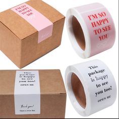 three rolls of pink and white stickers next to each other with words on them