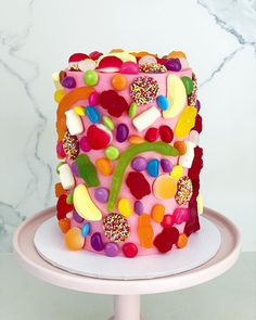 a colorful cake with lots of candies on it