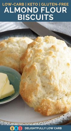 two biscuits on a plate with butter next to it and the words low carb keto gluten - free almond flour biscuits