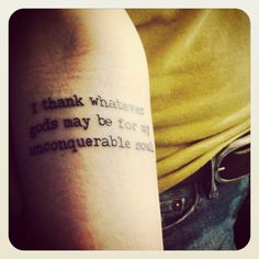 a person with a tattoo that says i thank whatever god may be for my unconquenable soul