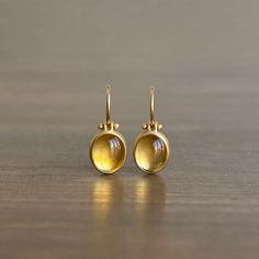 Intensely reflective golden citrines radiate a warm, beguiling glow.

18k yellow gold 
Citrines, 6.54ctw 9mm x 11mm (3/8" x 5/16") 
Earrings hang 7/8" from the ear 
Each earring weighs 2g Oval Earrings, Newport Ri, Oval Earring, Gift Card Shop, Bracelet Gift, Ring Necklace, Newport, Jewelry Care, Citrine