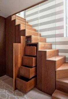 the stairs are made of wood and have drawers under them on each side for storage