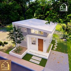 an aerial view of a small white house in the middle of a yard and trees