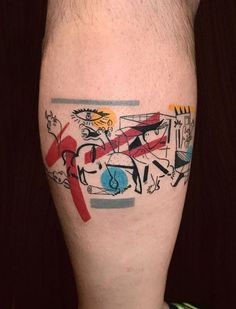 a man's leg with an abstract tattoo on it