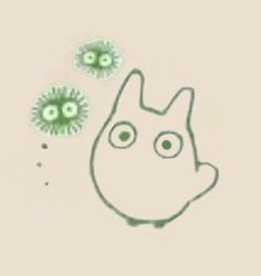 an animal with two green eyes in front of some germs