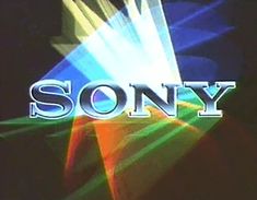 the words sony are projected on a screen with light rays coming from it and behind them