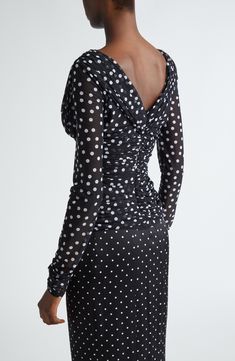 This polka-dot ruched tulle top is part of D&G's Mambo collection inspired by styles of the '40s and '50s combined with the iconography of American pin-ups. Surplice V-neck Long sleeves Stretch lining 92% polyamide, 8% spandex Dry clean Made in Italy Designer Clothing Fitted Party Top With Gathered Neckline, Elegant Polka Dot Party Tops, Elegant Ruched Polka Dot Dress, Elegant Evening Polka Dot Top, Elegant Polka Dot Evening Top, Elegant Fitted Polka Dot Top, Tulle Top, Pin Ups, Mambo