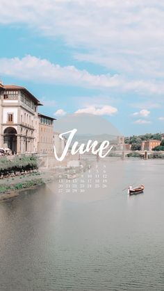 a calendar with the name june in front of a body of water next to buildings