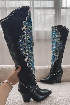 And the colors in this boot…totally shine!! Shop the shine today!! This stunning boot offers a classic yet stylish look with a black western knee-high cowboy boot, blue and silver rhinestone embellished design on the front, and a chipped block heel. Perfect for pairing with your favorite outfit, these boots are sure to add the perfect finishing touch. 3 3/4" heel Side zip closure Embellished Boots, Knee High Cowboy Boots, Bota Country, Amazing Lace, Block Heel Boots, Western Boot, Pointed Toe Shoes, Cowboy Boot, White Rhinestone