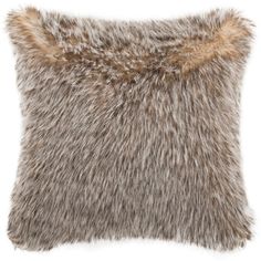 a grey and brown furry pillow on a white background with the fur in the middle