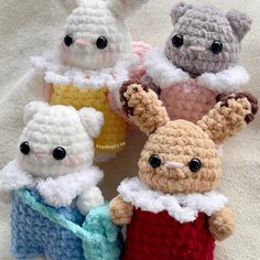 small crocheted stuffed animals sitting next to each other