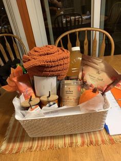 a basket filled with food sitting on top of a wooden table