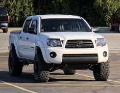 a white truck parked in a parking lot