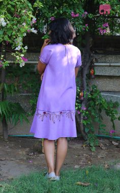 "Lavender tunic for women, Linen dress for women, Linen tunic, Made to order, Custom made, Plus size Make a statement with the adorable Madhubani motifs embroidered, knee length loose fitted linen dress. -Model height: 5'3\" wearing size S -Length: 39\" -Fit: Comfortable -Closure: Back neck hook -Indian madubani painting The lower half of this linen dress is hand embroidered with stylized floral motif." Purple Short Sleeve Midi Dress, Purple Tunic Dress For Summer, Purple Tunic Summer Dress, Summer Purple Tunic Dress, Lavender Knee-length Dress, Bohemian Purple Tunic Dress, Lavender Bohemian Short Sleeve Dress, Purple Bohemian Tunic Dress, Purple Cotton Knee-length Dress