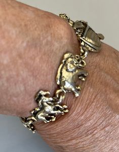 "Featuring this pretty Noah's Ark charm bracelet.  It is gold tone and measures 7\" in length.  It will fit a smaller wrist and is in good vintage condition.  There is a black spot on the roof of the ark and some dark spots on the back of the bracelet.  Priced accordingly.  The bracelet has a fold over clasp." Antique Gold Bracelet With Lobster Clasp, Yellow Gold Metal Bracelet With Vintage Charm, Adjustable Gold Vintage Charm Bracelet, Adjustable Gold Charm Bracelet With Vintage Charm, Antique Gold-tone Metal Bracelets, Adjustable Gold Bracelet With Vintage Charm, Adjustable Gold Bracelets With Vintage Charm, Adjustable Gold Charm Bracelet Collectible, Adjustable Gold Charm Bracelet