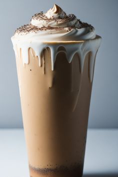 there is a chocolate drink with whipped cream on top