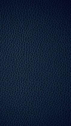 a dark blue leather texture background or wallpaper that looks like it has been painted