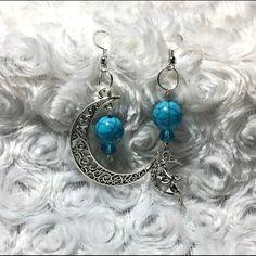 Beautiful Turquoise Bead Crescent Moon With Fairy Dangle Earrings. Turquoise Beads, Turquoise Crystals, Crescent Moon & Fairy Charms. Size: 2.6 Inches And 3 Inches From Earlobe Down. Metal: Tibetan Silver. Blue Moon-shaped Sterling Silver Earrings, Blue Crescent Moon Charm Earrings, Blue Moon-shaped Earrings With Moon Charm, Blue Dangle Earrings With Moon Charm, Blue Moon Shaped Earrings With Moon Charm, Blue Moon Charm Earrings, Bohemian Blue Moon Shaped Earrings, Bohemian Blue Moon-shaped Earrings, Blue Moon Shaped Sterling Silver Earrings