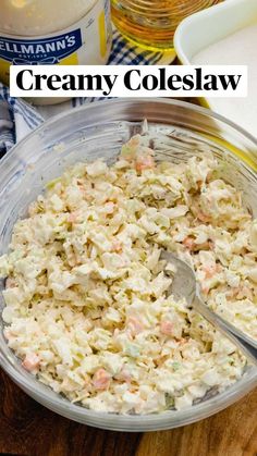 a bowl filled with coleslaw next to a container of mayonnaise and other ingredients