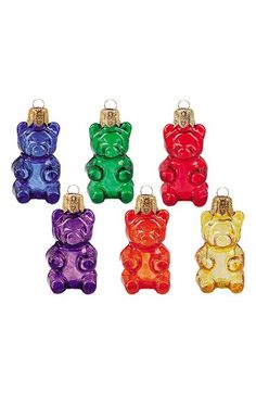 four different colored gummy bear ornaments in the shape of bears