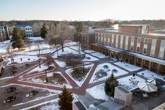 an aerial view of a snow covered courtyard