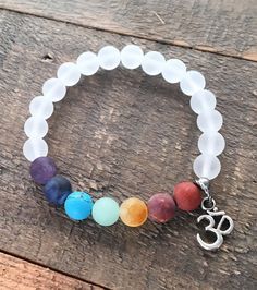 Wear the Rainbow! Matte gemstone chakra gemstones paired with matte genuine rock crystal quartz.  Rock crystal quartz has the wonderful quality of amplifying the qualities of gemstones it is paired with, which means that it makes other gemstones stronger and more powerful! #chakrabracelet Gemstone Bracelets Ideas, Chakra Gemstones, Om Charm, Women Bracelets, Quartz Rock, Photo Charms, Wearable Tech