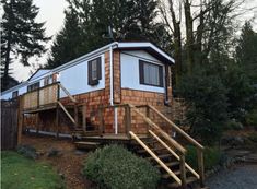 a small house with stairs leading up to it