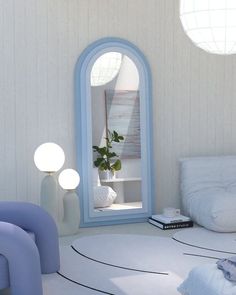 a room with white walls and blue furniture