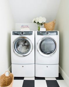 a washer and dryer sitting next to each other on a checkered floor