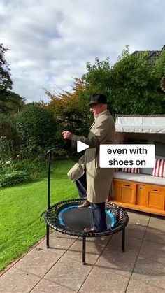 a man standing on top of a trampoline with an open sign saying even with shoes on