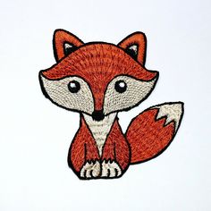 a red fox embroidered on a white background