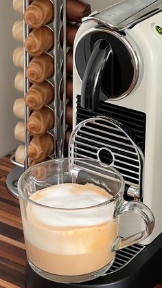 there is a coffee maker with doughnuts in it