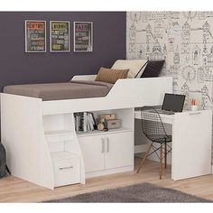 a white loft bed with desk underneath it