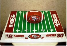 a cake shaped like a football on top of a field