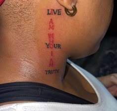 the back of a man's neck with words on it that read live, i am your i am truth