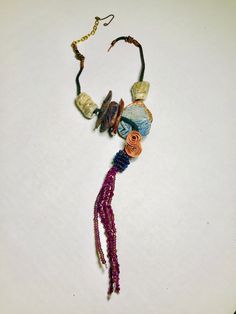 18" cord with extension chain 10" vertical drop 8 multi colored Raku beads over 40 mixed acrylic and wood beads Tribal! Got Q This piece offers a length of 18", including an adjustable 10" extension chain, for a total vertical drop of 8". The bold, multicolored Raku beads are complemented by more than 40 mixed acrylic and wood beads. Perfect for creating a dramatic, tribal-inspired look. uestions???? Instant Message or Chat with me. Shipping and Returns Art Festival, Wood Beads, Over 40, Multi Colored, Beaded Necklace, Drop Earrings, Beads, Chain, Wood